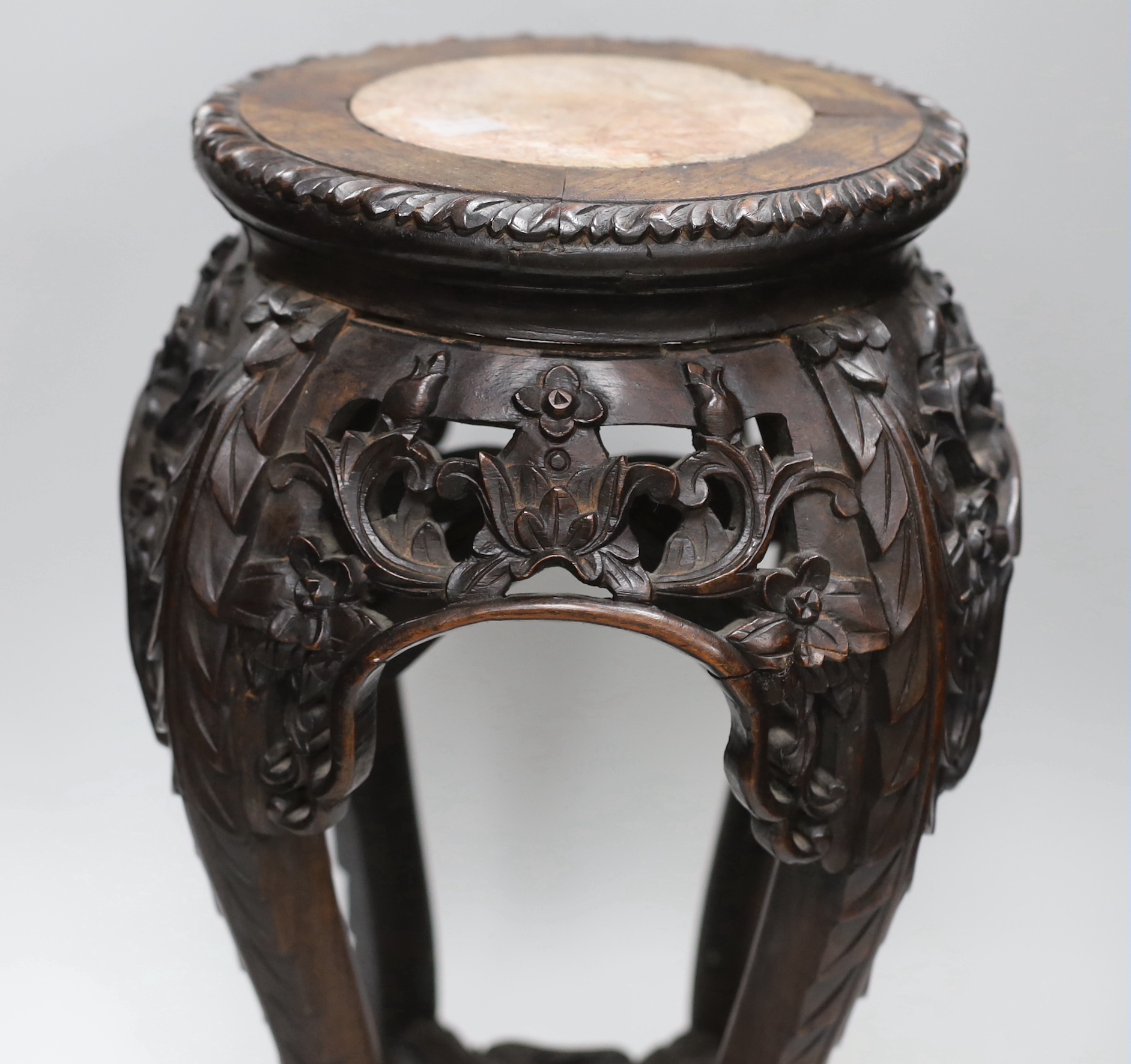 A Chinese carved hardwood marble topped vase stand, height 46cm